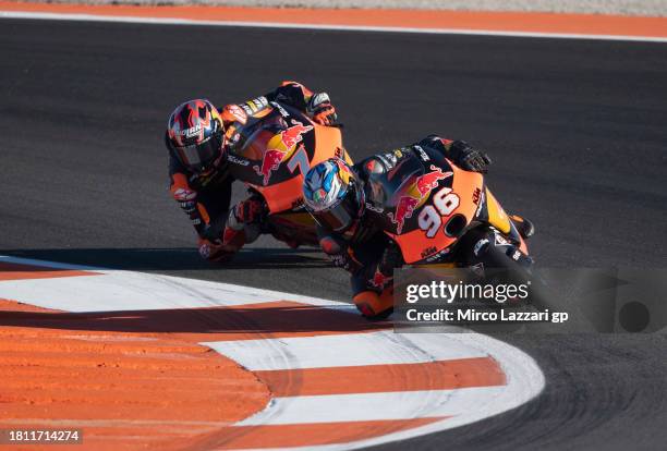 Daniel Holgado of Spain and Red Bull KTM Tech3 leads Filippo Farioli of Italy and Red Bull KTM Ajo during the MotoGP of Valencia - Practice at...