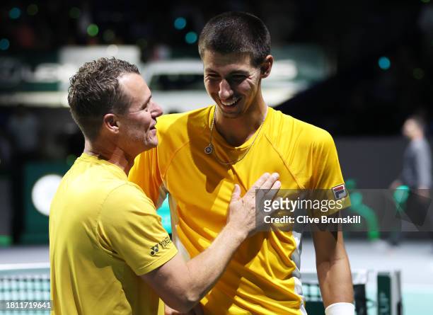 Alexei Popyrin celebrates with Lleyton Hewitt of Australia winning match point during the Semi-Final match against Otto Virtanen of Finland in the...