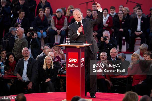 German Social Democrats chancellor candidate Peer Steinbrueck speaks to visitors at an SPD election rally on September 16, 2013 in Berlin, Germany....