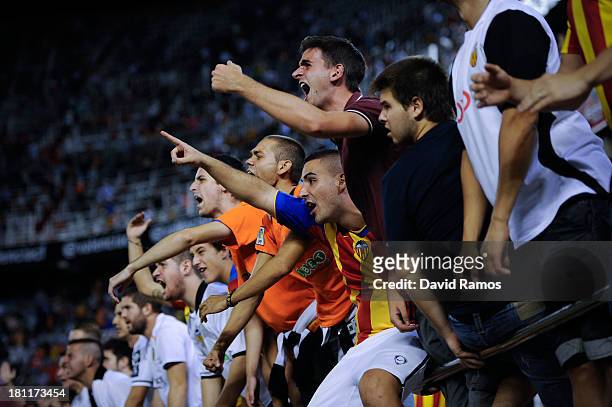 Valencia CF supporters protest against their team after being defeated by Swansea City at the end of the UEFA Europa League Group A match between...