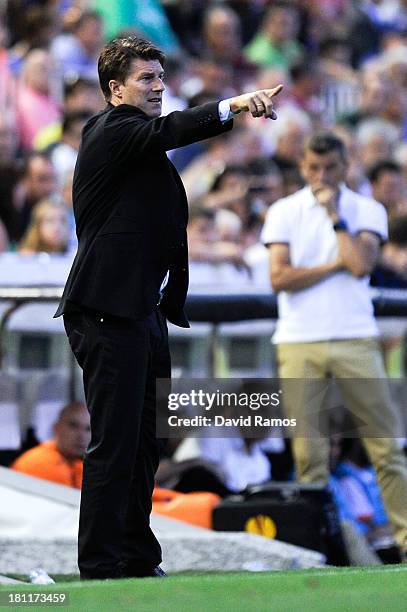 Manager Michael Laudrup of Swansea City gives instructions during the UEFA Europa League Group A match between Valencia CF and Swansea City at Estadi...