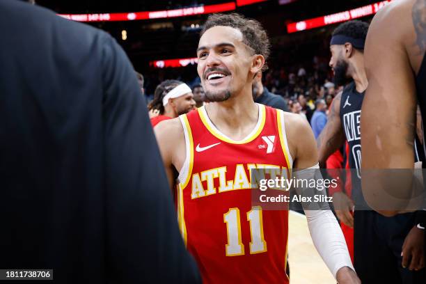 Trae Young of the Atlanta Hawks shakes hands with members of the Brooklyn Nets after a game at State Farm Arena on November 22, 2023 in Atlanta,...