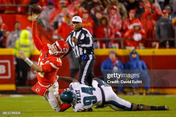 Patrick Mahomes of the Kansas City Chiefs throws a pass ruled intentional grounding during the fourth quarter with pressure from Josh Sweat of the...