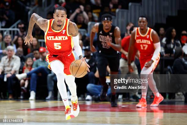 Dejounte Murray of the Atlanta Hawks drives against the Brooklyn Nets during the first half at State Farm Arena on November 22, 2023 in Atlanta,...