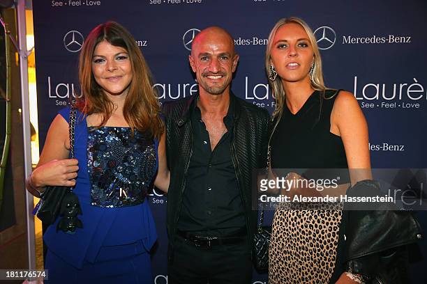 Peyman Amin, Julia Tewaag and guest attend the Laurel flagship store opening on September 19, 2013 in Munich, Germany.