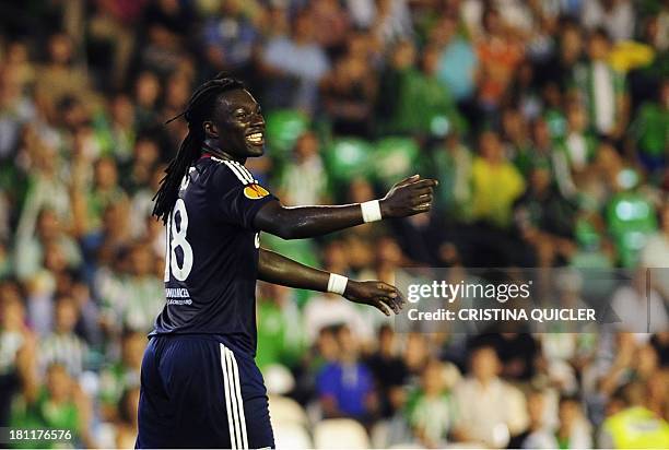 Lyon's French forward Bafetimbi Gomis reacts during the UEFA Europa League football match Real Betis vs Olympique Lyonnais at the Benito Villamarin...