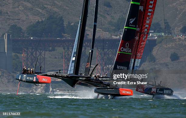 Emirates Team New Zealand skippered by Dean Barker races Oracle Team USA skippered by James Spithill in race 12 of the America's Cup Finals on...