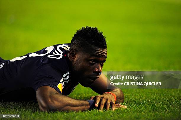 Lyon's Cameroonian defender Henri Bedimo reacts during the UEFA Europa League football match Real Betis vs Olympique Lyonnais at the Benito...