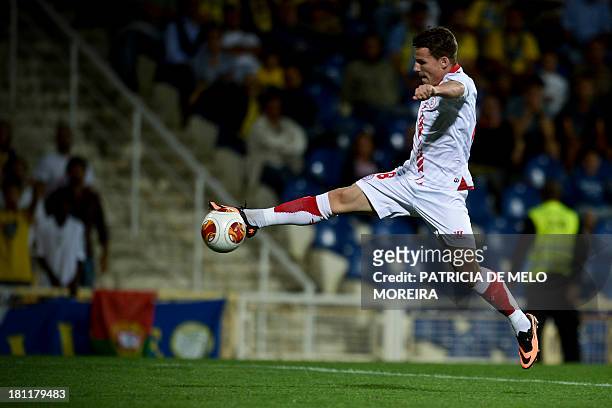 Sevilla's French forward Kevin Gameiro scores during the UEFA Europa League, group H, football match Estoril vs Sevilla at the Antonio Coimbra da...