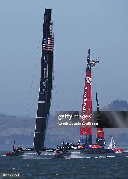 Oracle Team USA skippered James Spithill in action against Emirates Team New Zealand skippered Dean Barker during race twelve of the America's Cup...