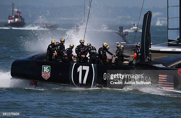 Oracle Team USA skippered James Spithill crosses the finish line ahead of Emirates Team New Zealand skippered Dean Barker to win race twelve of the...