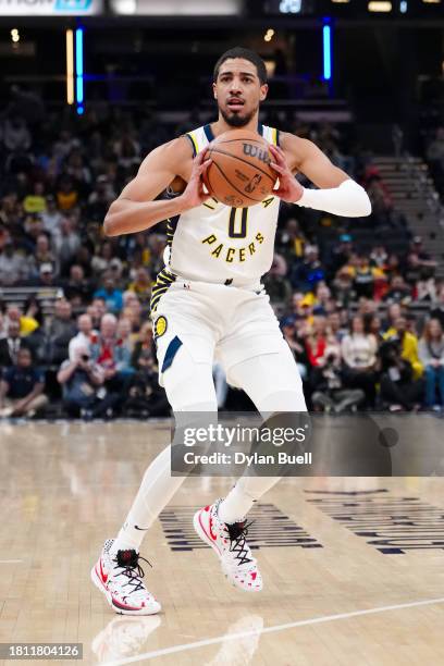 Tyrese Haliburton of the Indiana Pacers passes the ball in the first quarter against the Toronto Raptors at Gainbridge Fieldhouse on November 22,...