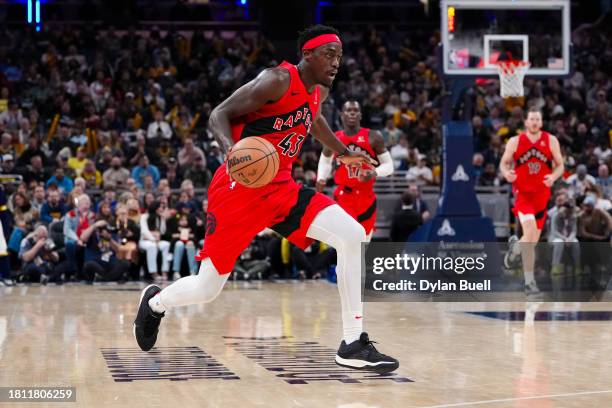 Pascal Siakam of the Toronto Raptors dribbles the ball in the third quarter against the Indiana Pacers at Gainbridge Fieldhouse on November 22, 2023...