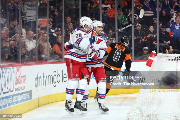 Chris Kreider and Blake Wheeler of the New York Rangers react following a goal by Kreider during the first period against the Philadelphia Flyers at...