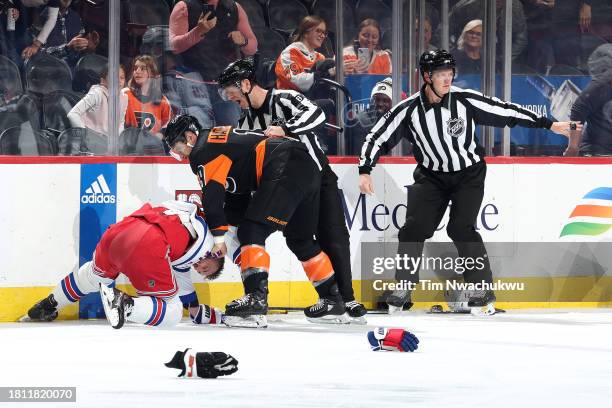 Barclay Goodrow of the New York Rangers and Garnet Hathaway of the Philadelphia Flyers fight during the first period at the Wells Fargo Center on...