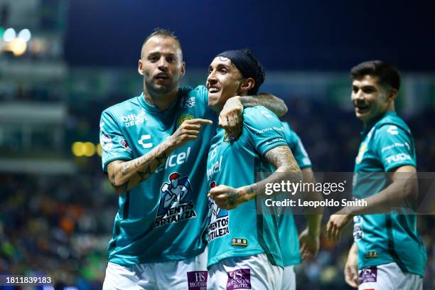 Nicolas Lopez of Leon celebrates after scoring the team's second goal with his teammate Omar Fernandez during the quarterfinals first leg match...