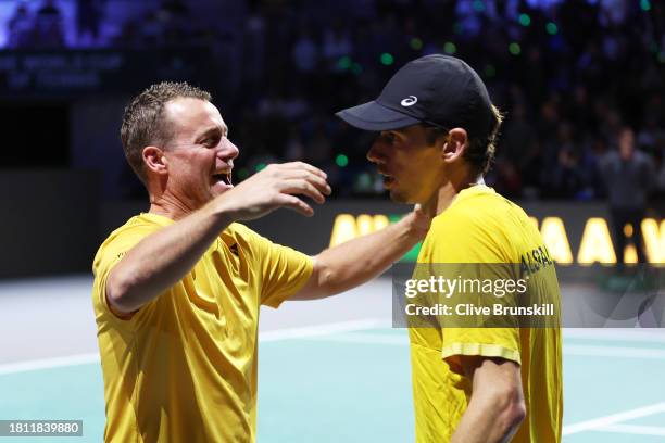 Alex De Minaur celebrates winning match point with Lleyton Hewitt of Australia during the Semi-Final match against Emil Ruusuvuori of Finland in the...