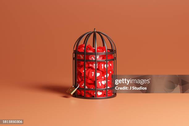 social media icons locked in birdcage 2 - loneliness icon stock pictures, royalty-free photos & images