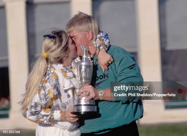 John Daly of the United States with his wife Paulette holding the trophy after winning the British Open Golf Championship held at the Old Course at...