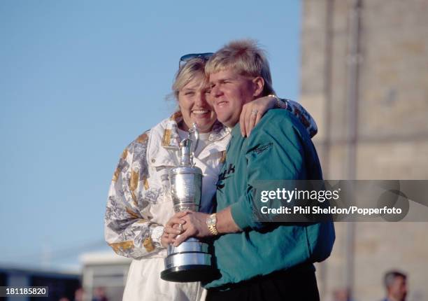 John Daly of the United States with his wife Paulette holding the trophy after winning the British Open Golf Championship held at the Old Course at...