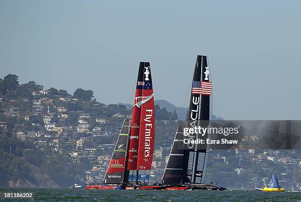 Emirates Team New Zealand skippered by Dean Barker in action against Oracle Team USA skippered by James Spithill during race 12 of the America's Cup...