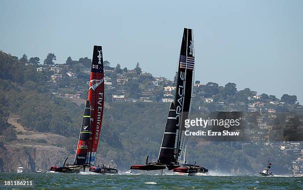 Emirates Team New Zealand skippered by Dean Barker in action against Oracle Team USA skippered by James Spithill during race 12 of the America's Cup...