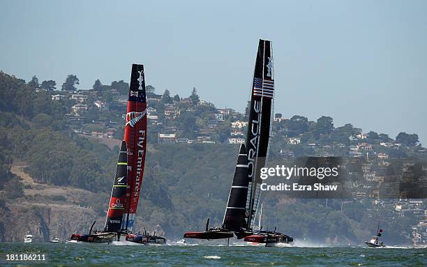 Emirates Team New Zealand skippered by Dean Barker in action against Oracle Team USA skippered by James Spithill during race 12 of the America's Cup...