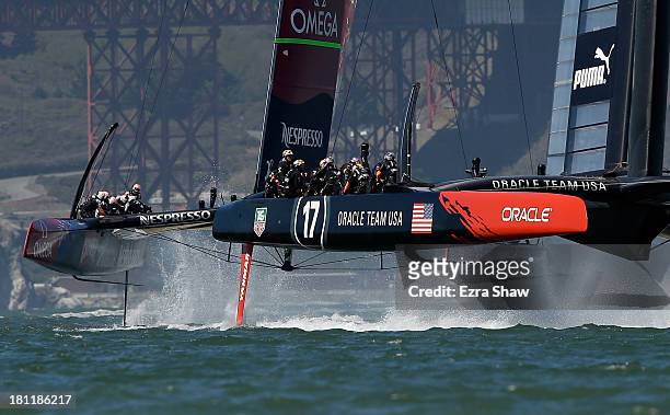 Emirates Team New Zealand skippered by Dean Barker in action against Oracle Team USA skippered by James Spithill during race 12 of the America's Cup...
