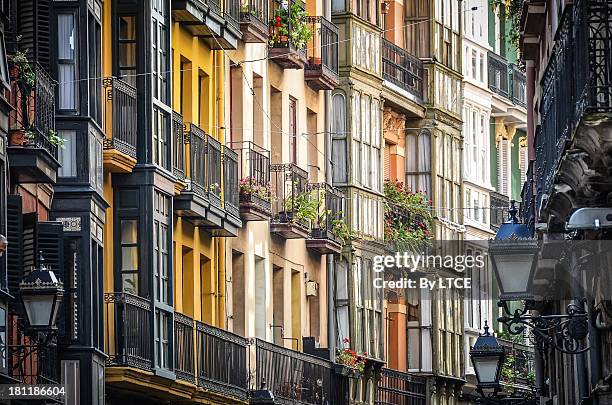 colourful facades of the old district in bilbao - bilbao photos et images de collection