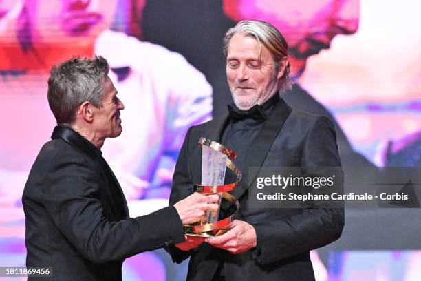 Willem Dafoe and Mads Mikkelsen on stage during the opening ceremony during the 20th Marrakech International Film Festival on November 24, 2023 in...