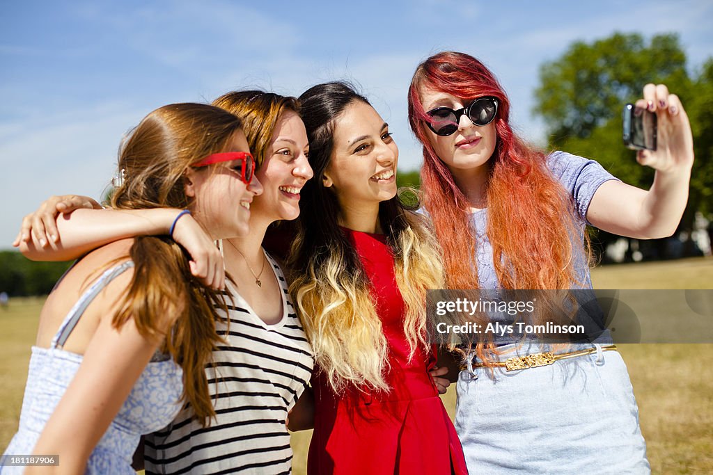 Girls taking a photo together in the sun