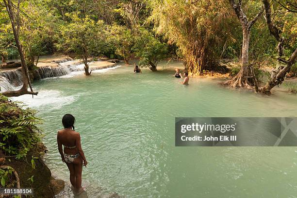 tat kuang si, lower pool with visitors - kuang si falls stock pictures, royalty-free photos & images