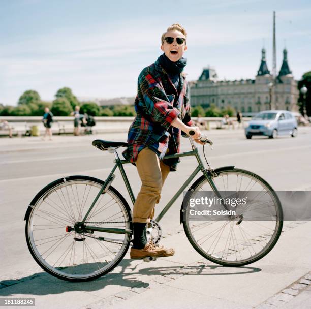 portrait of a cyclist in city surroundings - copenhagen bicycle stock pictures, royalty-free photos & images