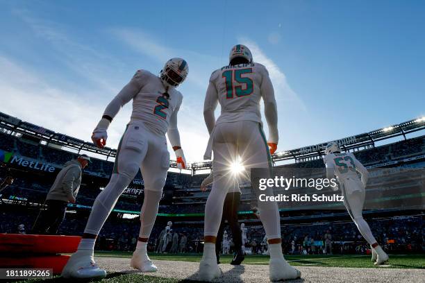 Bradley Chubb and Jaelan Phillips of the Miami Dolphins talk on the sidelines prior to the game against the New York Jets at MetLife Stadium on...