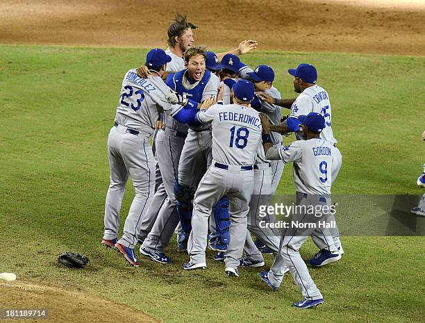 Ellis and teammates of the Los Angeles Dodgers celebrate clinching the National League West Division Title against the Arizona Diamondbacks after a...