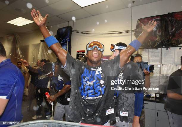 Yasiel Puig of the Los Angeles Dodgers celebrates in the locker room after defeating the Arizona Diamondbacks to clinch the National League West...