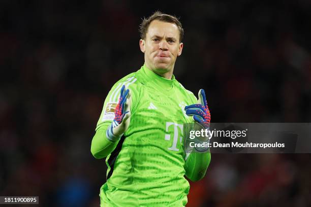 Manuel Neuer of Bayern Munich celebrates after Harry Kane of Bayern Munich scores their sides first goal during the Bundesliga match between 1. FC...