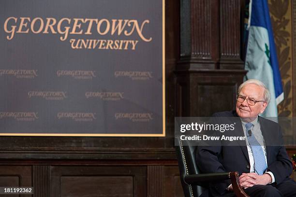 Warren Buffett, chairman of the board and CEO of Berkshire Hathaway, is introduced in Gaston Hall at Georgetown University, September 19, 2013 in...