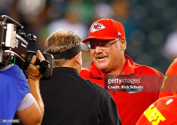 Head coach Andy Reid of the Kansas City Chiefs talks to head coach Chip Kelly of the Philadelphia Eagles prior to the game at Lincoln Financial Field...