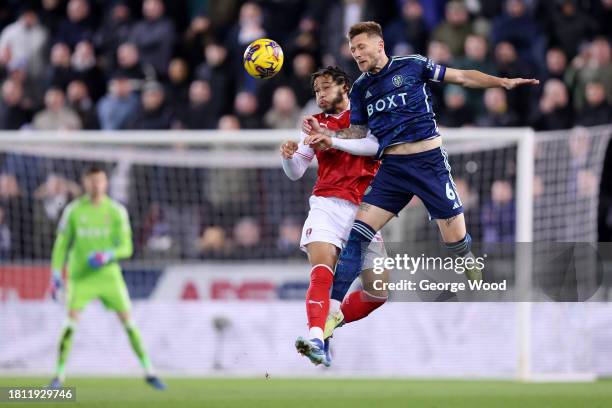 Sam Nombe of Rotherham United competes for a header with Liam Cooper of Leeds United during the Sky Bet Championship match between Rotherham United...