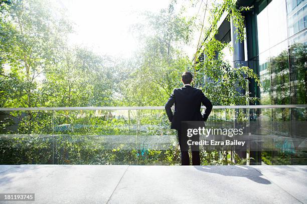 businessman thinking about green energy. - unternehmensethik stock-fotos und bilder