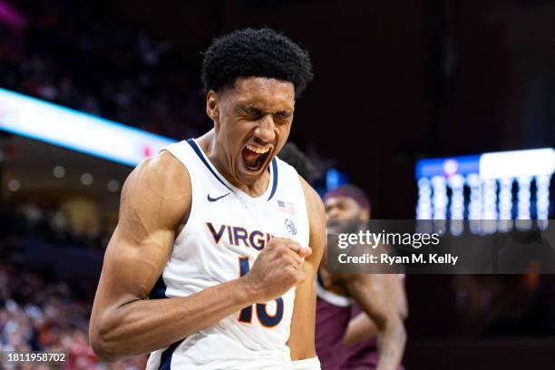 Ryan Dunn of the Virginia Cavaliers celebrates a dunk in the second half during a game against the Texas A&M Aggies at John Paul Jones Arena on...