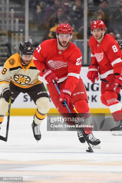 Michael Rasmussen of the Detroit Red Wings skates with the puck against the Boston Bruins on November 24, 2023 at the TD Garden in Boston,...