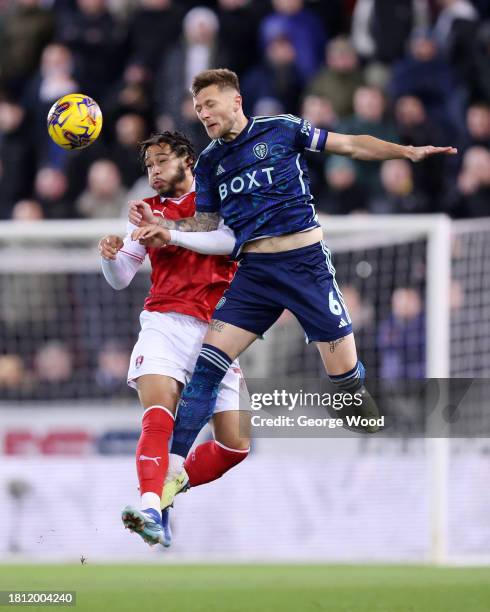 Sam Nombe of Rotherham United competes for a header with Liam Cooper of Leeds United during the Sky Bet Championship match between Rotherham United...