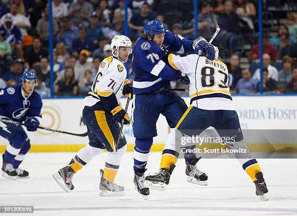 Pierre-Cedric Labrie of the Tampa Bay Lightning collides with Anthony Bitetto of the Nashville Predators during the second period in a preseason game...