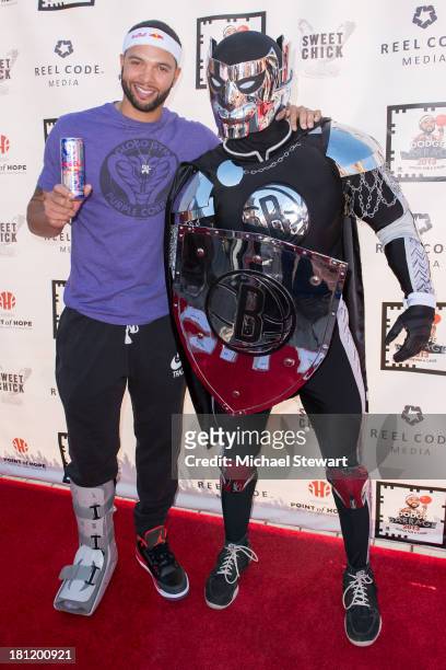 Brooklyn Nets player Deron Williams and the BrooklyKnight attend Dodge Barrage 2013 at Pier 36 on September 19, 2013 in New York City.
