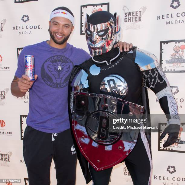 Brooklyn Nets player Deron Williams and the BrooklyKnight attend Dodge Barrage 2013 at Pier 36 on September 19, 2013 in New York City.