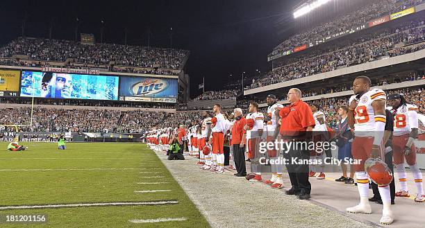 Kansas City Chiefs head coach Andy Reid stands for the national anthem with his team before the start of play against the Philadelphia Eagles at...