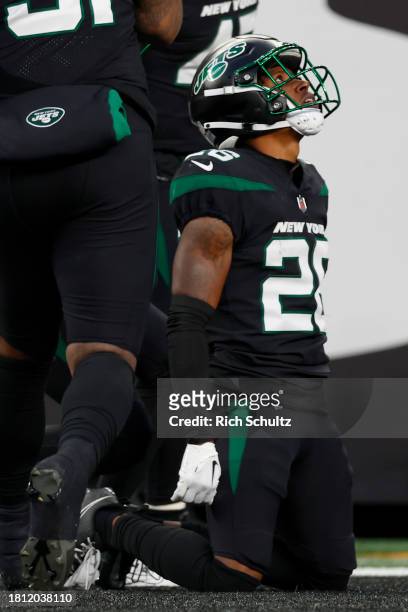 Brandin Echols of the New York Jets celebrates with his teammates after incepting a pass to score a touchdown against the Miami Dolphins during the...