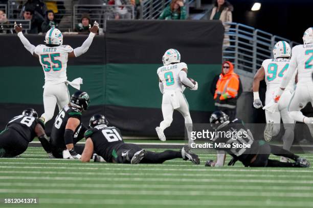 Jevon Holland of the Miami Dolphins scores a 99 yard touchdown off of an interception thrown by Tim Boyle of the New York Jets during the second...
